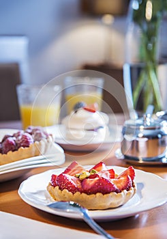 Tart with fresh raspberries on a plate