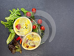 Tart, vegetables and food on dark background for bakery with pastry, nutrition and brunch meal. Pie, carbs and tomato on