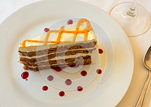 Tarta de zanahoria. Tender sweet slice of soft carrot cake with cream cheese glaze photo