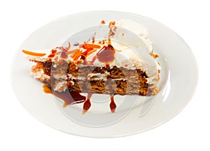 Tarta de zanahoria. Tender sweet slice of soft carrot cake with cream cheese glaze photo