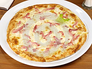 Tarte Flambee with Creme Fraiche, Onion and Bacon, isolated on white Background