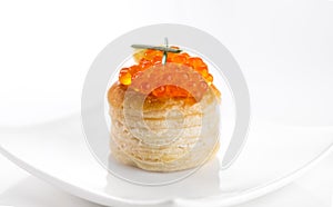 Tartlet with red caviar close up. Gourmet food close up, appetizer. Close-up salmon caviar. Delicatessen