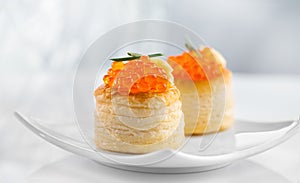 Tartlet with red caviar close up. Gourmet food close up, appetizer. Close-up salmon caviar. Delicatessen