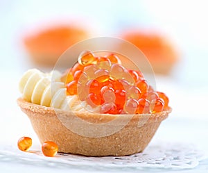 Tartlet with red caviar closeup