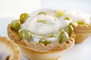 Tartlet with salad on a white plate