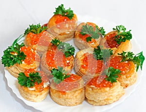 Tartlets with caviar and parsley