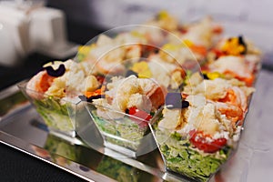 tartlets with pate and salad garnished with flowers. Delicious appetizers.