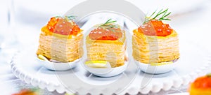 Tartlets with red caviar photo