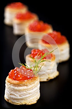 Tartlets with red caviar