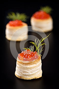 Tartlets with red caviar