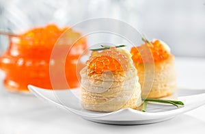 Tartlets with red caviar close up. Gourmet food close up, appetizer. Close-up salmon caviar. Delicatessen