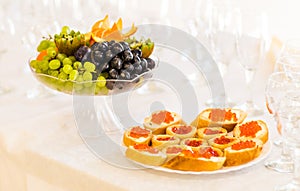 Tartlets with red caviar close up. Gourmet food closeup, appetizer