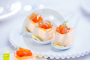 Tartlets with red caviar photo