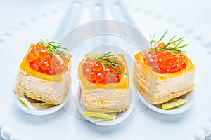 Tartlets with red caviar photo