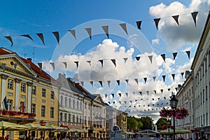 Tartu Estonia 08.15.19 Town hall square buildings and festival flags