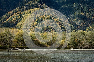 Tashiro Pond, one of Kamikochi`s most scenic spots, is a small pond surrounded by marshland. Photo during October 2023 on fall fol