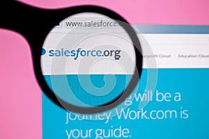 Tashkent, Uzbekistan, May 15, 2020: Photo of Salesforce website homepage on a monitor screen through a magnifying glass.