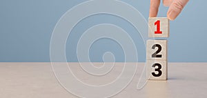 Task priority and management concept. Wooden cube blocks with number first, second and third. Set work priority, arrange to do