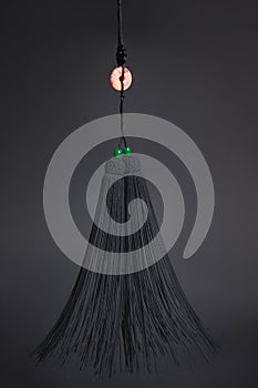 Tassel of Tai Chi sword on the black background