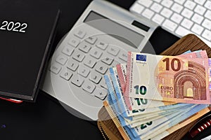 Tastatures, euro bills, wallet and zipbook calendar