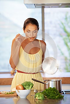 Taste, cooking and woman with vegetables in kitchen for healthy, wellness and diet soup. Food, ingredients and female