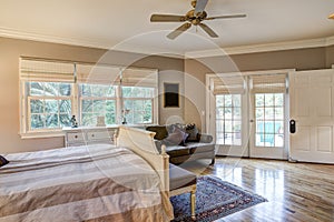 Tasteful bedroom interior with hard wood floors