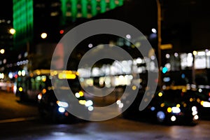 Tasteful bokeh effect of traffic and city lights seen in a modern North American city at nightfall.