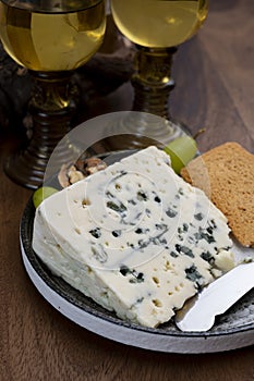 Tastig of French king of cheeses, sheep milk blue cheese roquefort from Southern France with sweet dessert white wine
