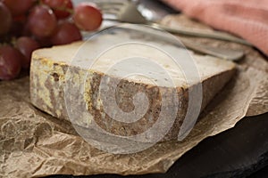 Tasting of ancient french demi soft cheese Tomme from French Alp