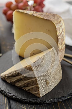 Tasting of ancient french demi soft cheese Tomme from French Alp