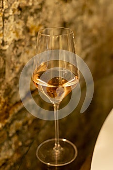 Tasting of brut champagne sparkling wine produced by traditional method in underground caves