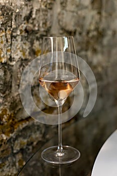 Tasting of brut champagne sparkling wine produced by traditional method in underground caves