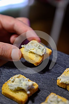 Tasting of Cabrales blue cheese made bdairy farmers in Asturias, Spain from unpasteurized cowâ€™s milk or blended with