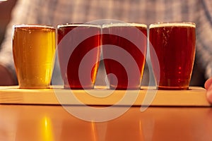 Tasting craft beer samples from a flight