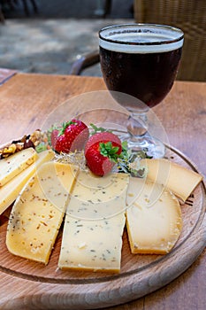 Tasting of different Belgian cheeses and dark strong Belgian beer served outdoor