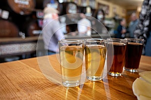 Tasting of different sweet wines from wooden barrels on old bodega in central part of Malaga, Andalusia, Spain