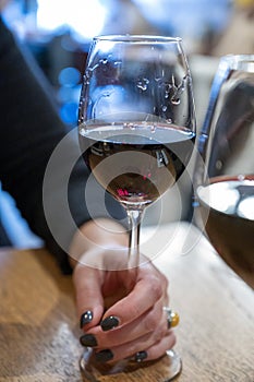 Tasting of dry Italian primitivo red wine in Italian cantina restaurant in Puglia