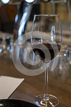 Tasting of dry Spanish tempranillo red wine in Spanish bogeda restaurant photo