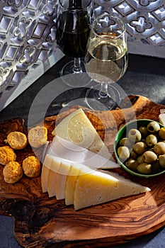 Tasting of fortified Andalusian dry and sweet sherry wine with traditional Spanisch tapas, green olives, goat and sheep manchego