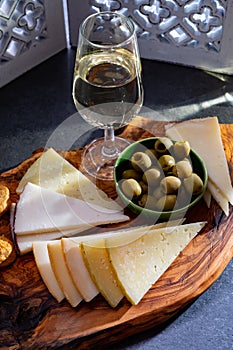 Tasting of fortified Andalusian sherry wine with traditional Spanisch tapas, green olives, goat and sheep manchego cheese