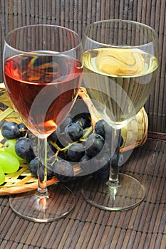 Tasting of grape and bottle of red and white wine