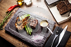 Tasting menu. Beef steak and grilled tiger prawns.