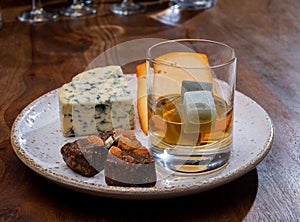 Tasting and pairing of different cheeses with strong alcoholic drinks, whisky, cognac or calvados