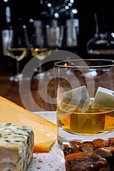 Tasting and pairing of different cheeses with strong alcoholic drinks, whisky, cognac or calvados