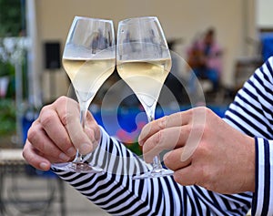 Tasting of sparkling white wine with bubbles champagne on summer festival route of champagne in Cote des Bar, Champagne region,