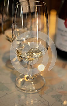 Tasting of white dry chablis wine in small winery in Chablis town, Burgundy, France