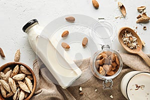 Tasty almond milk on white background