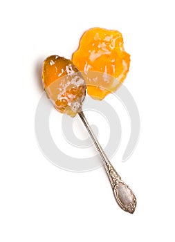 Tasty apricot jam in spoon.
