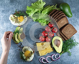 tasty avocado, sandwiches on whole grain bread with tri-colored tomatoes on rustic baking tray