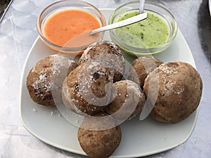 Tasty backed potatoes with two souse photo